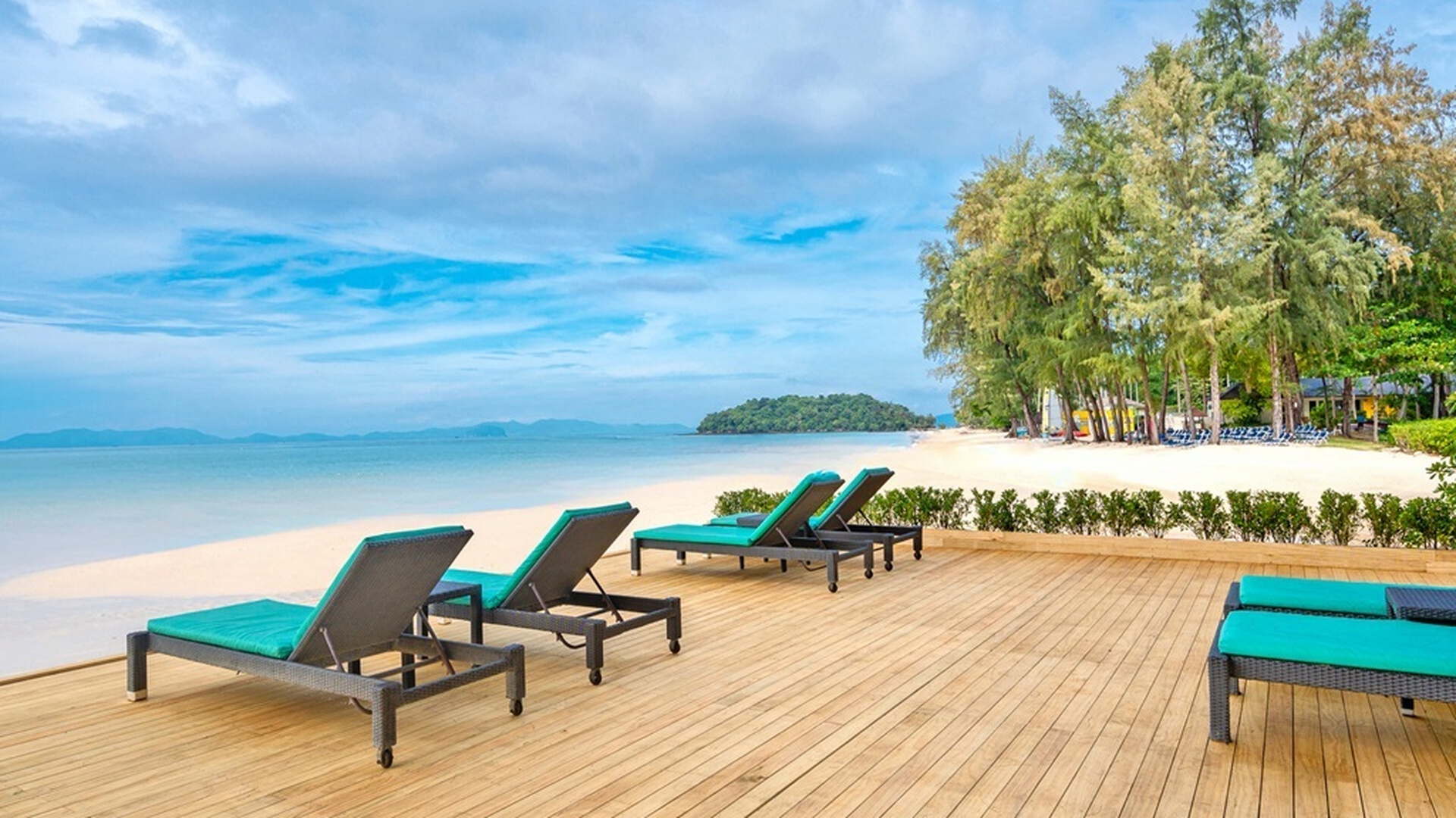  a tranquil lounging deck at the Dusit Thani Krabi Beach Resort, located on Klong Muang Beach in Krabi, Thailand