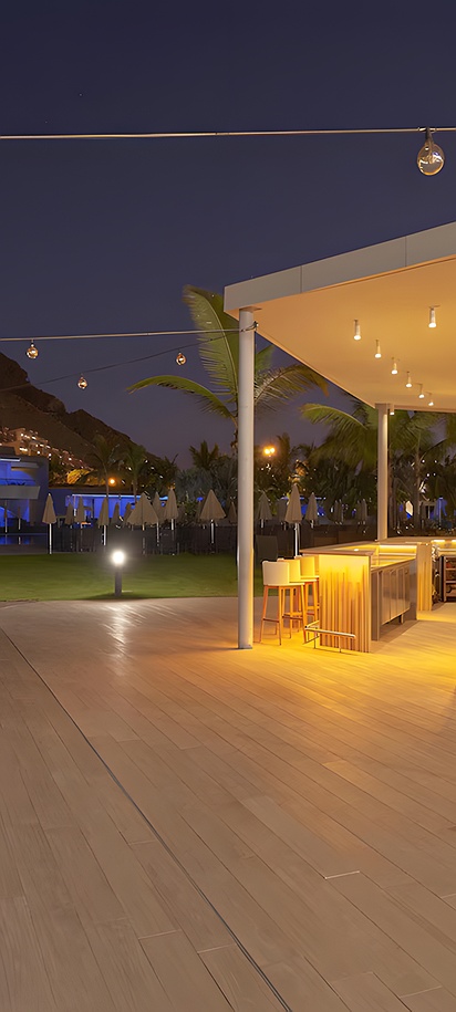 an evening view of a bar and lounge area at the Radisson Blu Resort & Spa in Gran Canaria Mogán