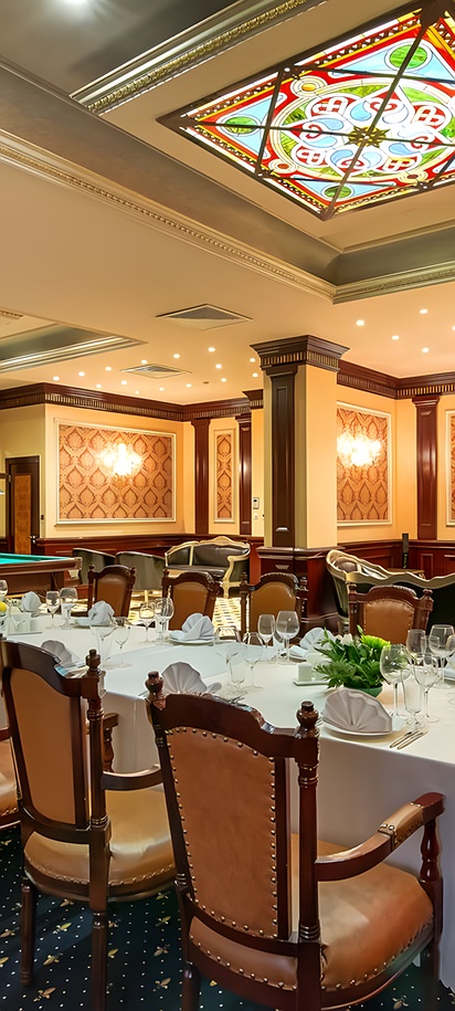 dining room and billiards area inside a luxury hotel, the Royal Tulip Almaty