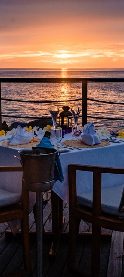 sunset dining setup is located at the Hilton Seychelles Northolme Resort & Spa