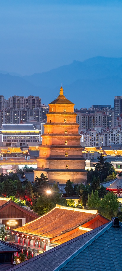 night view of the historic Giant Wild Goose Pagoda and the surrounding Tang Dynasty style architecture in Xi'an, China