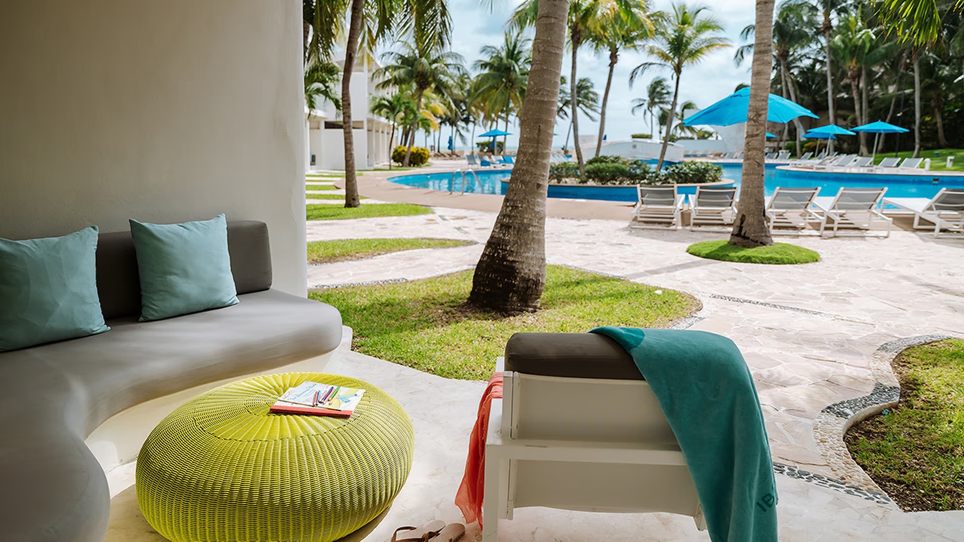 a relaxing outdoor lounging area at the Iberostar Selection Riviera Cancun resort in Mexico
