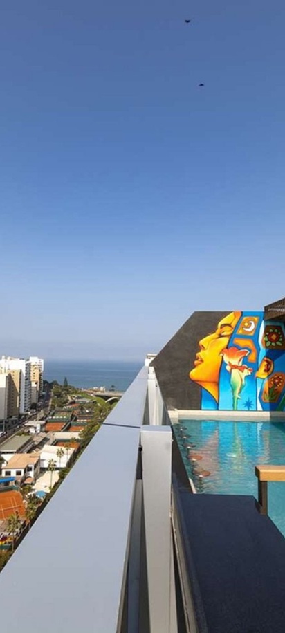the rooftop pool and terrace area of the Hilton Garden Inn Lima Miraflores hotel, located in Lima, Peru