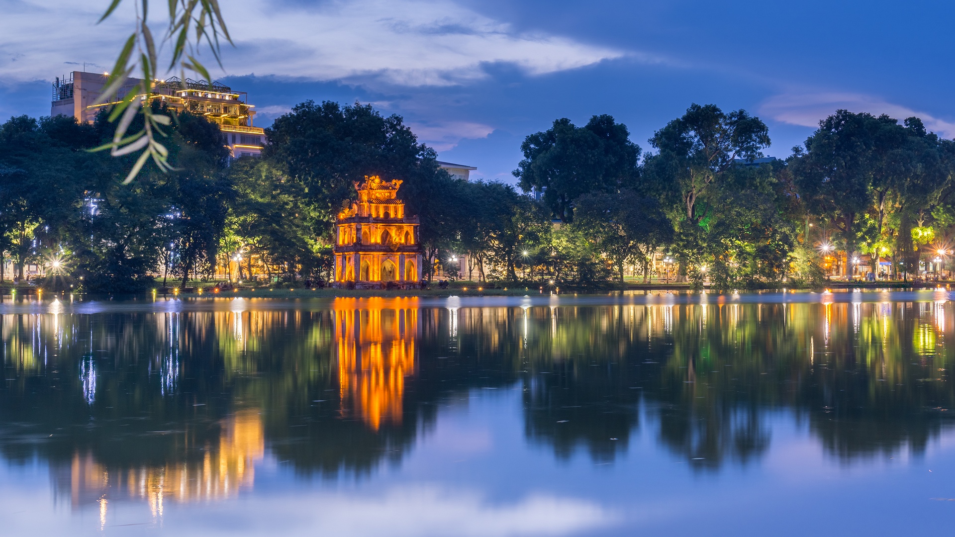 Hoàn Kiếm Lake (Lake of the Returned Sword) and the illuminated Turtle Tower (Tháp Rùa) in Hanoi, Vietnam