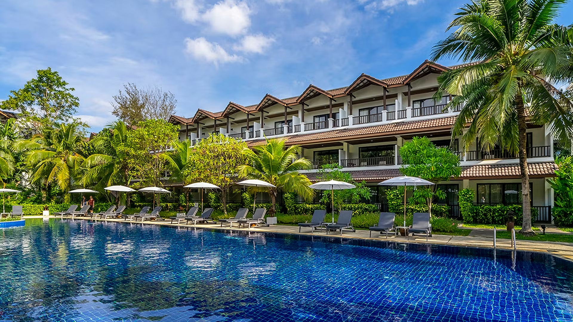 the pool area of the Kamala Beach Resort, a Sunprime Resort located in Phuket, Thailand