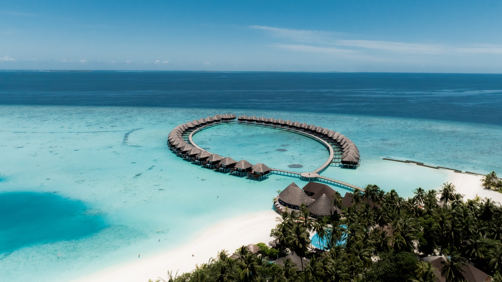 Sun Siyam Vilu Reef overwater villa aerial view