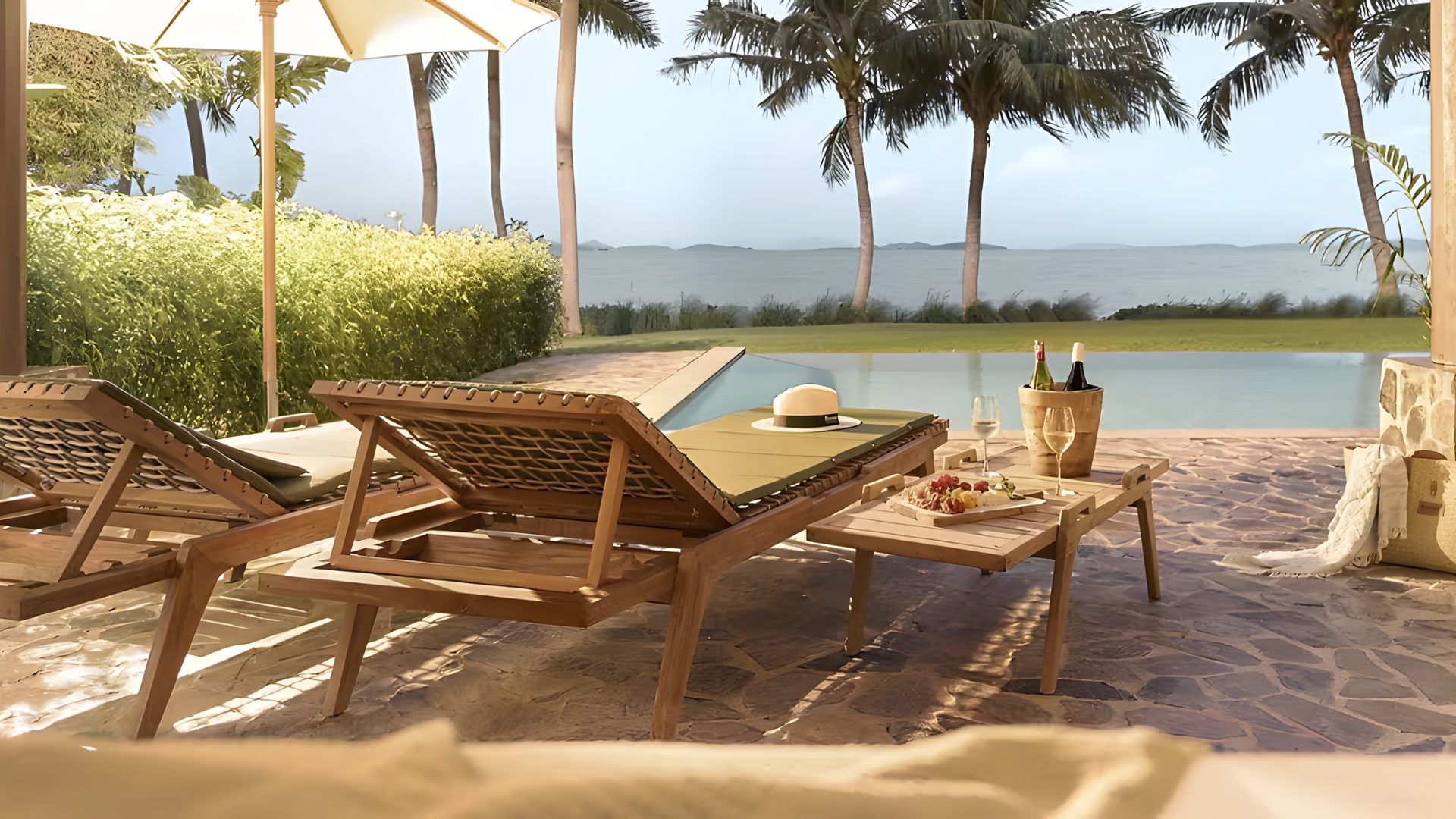 a luxurious beachfront suite at the Barceló Coconut Island resort in Phuket, Thailand.  The resort is situated on a private island called Koh Maphrao, a short boat ride from the main island of Phuket.  Accommodations include private pool villas and suites overlooking Phang Nga Bay.  Guests can access dining options, a spa, and 24-hour boat service to the mainland.  The area is known for its tropical foliage, palm trees, and secluded atmosphere.  Barceló Coconut Island Resort in Thailand | From 84£ - Barcelo A concept designed for those who want to enjoy life on an idyllic island for longer, with all the necessary services, whether for ...  Barceló® Hotel Group  Barceló Coconut Island, Phuket - TUI A private beach stretches out in front of the hotel, with tropical gardens and lofty palms filling the area behind it. Amongst the...  TUI.co.uk  Barceló Coconut Island Hotel Review, Phuket, Thailand 29 Jan 2026 — Arriving by speedboat at the wooden jetty that looks like it's straight out of Pirates of the Caribbean – with white wa...  The Telegraph  Show all