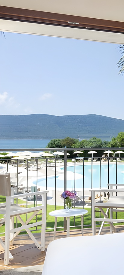 a room with a balcony view at the Hotel Corte Rosada Affiliated by Meliá in Alghero, Italy