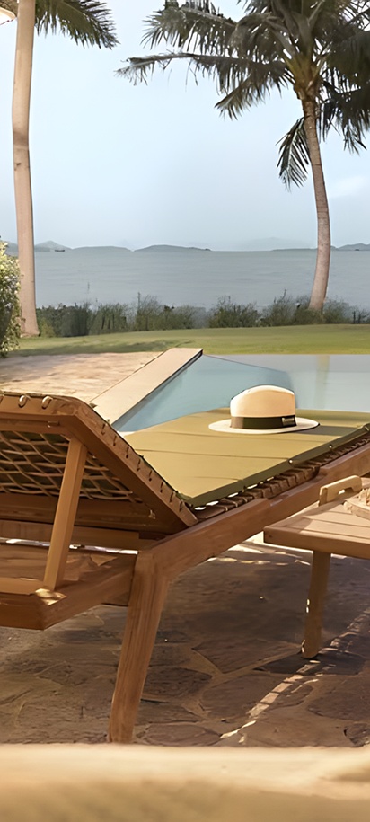 a luxurious beachfront suite at the Barceló Coconut Island resort in Phuket, Thailand.  The resort is situated on a private island called Koh Maphrao, a short boat ride from the main island of Phuket.  Accommodations include private pool villas and suites overlooking Phang Nga Bay.  Guests can access dining options, a spa, and 24-hour boat service to the mainland.  The area is known for its tropical foliage, palm trees, and secluded atmosphere.  Barceló Coconut Island Resort in Thailand | From 84£ - Barcelo A concept designed for those who want to enjoy life on an idyllic island for longer, with all the necessary services, whether for ...  Barceló® Hotel Group  Barceló Coconut Island, Phuket - TUI A private beach stretches out in front of the hotel, with tropical gardens and lofty palms filling the area behind it. Amongst the...  TUI.co.uk  Barceló Coconut Island Hotel Review, Phuket, Thailand 29 Jan 2026 — Arriving by speedboat at the wooden jetty that looks like it's straight out of Pirates of the Caribbean – with white wa...  The Telegraph  Show all