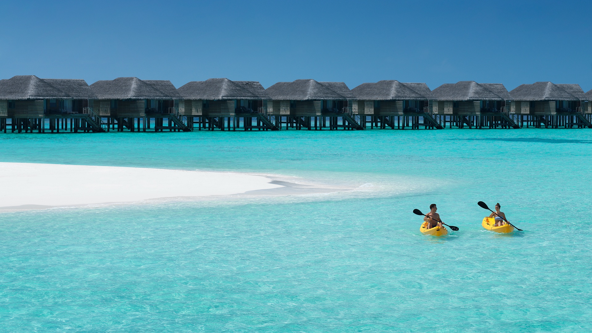 overwater villas at the Vakkaru Maldives resort.