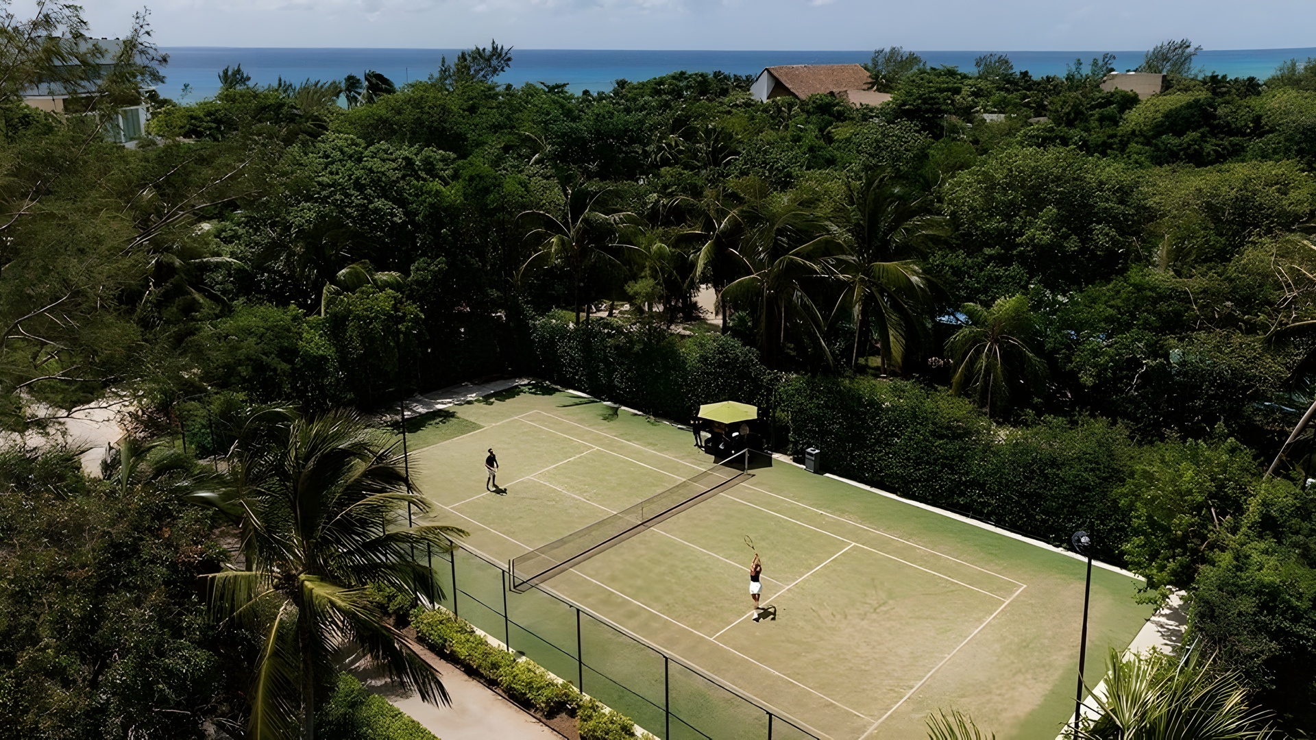 tennis court at The Fives Oceanfront Riviera Maya