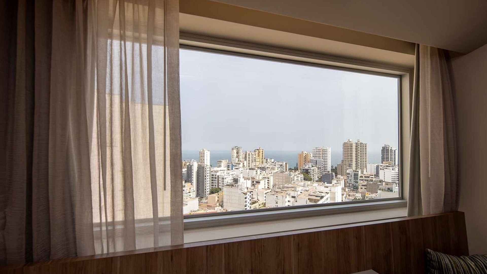 a room with a city view at the Hilton Garden Inn Lima Miraflores hotel in Lima, Peru.  The hotel is located in the popular tourist district of Miraflores, within walking distance of attractions like John F. Kennedy Park and the Pacific coast.  It is a 4-star property featuring 235 guest rooms, a rooftop pool, a fitness center, and an onsite restaurant called The Garden Grille.  The area is known for its modern urban landscape, restaurants, and shopping centers.  HILTON GARDEN INN LIMA MIRAFLORES - Hotel Reviews, Photos ... Hilton Garden Inn Lima Miraflores is popular among travelers for its modern amenities, including a rooftop pool, gym, and an excel...  Tripadvisor  Hilton Garden Inn Lima Miraflores A stay near South Pacific views. Inspired by the Pacific Ocean, we're located in Lima's most popular tourist district. We offer ea...  Hilton  Hotel Hilton Garden Inn Lima Miraflores - Reserving Book your room at Hotel Hilton Garden Inn Lima Miraflores and take advantage of our offers and discounts on accommodations in Lima...  reserving.com  Show all