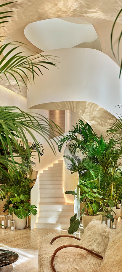 the lushly planted lobby of The Tampa EDITION hotel