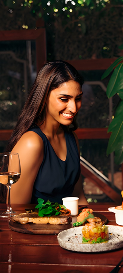 a group of people enjoying a meal together at a restaurant