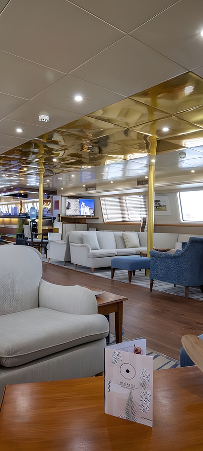 the indoor lounge and bar area of the M/Y Pegasos mega yacht
