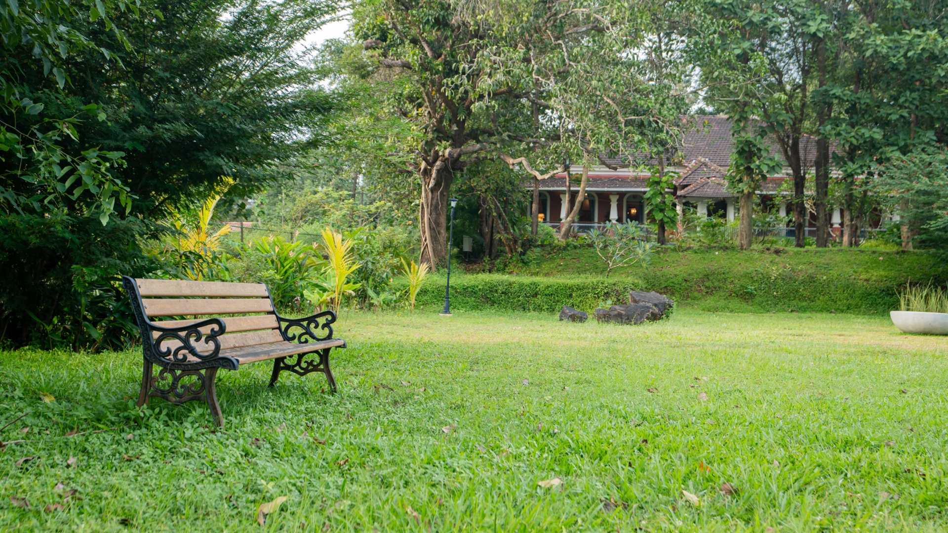 the lush garden and grounds of the Mansao Curtorim heritage villa in South Goa, India