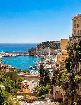 fleet of Formula 1 cars navigating the legendary Fairmont Hairpin (formerly known as the Loews Hairpin) during the Monaco Grand Prix