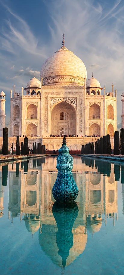 Taj Mahal with reflection in water at sunrise