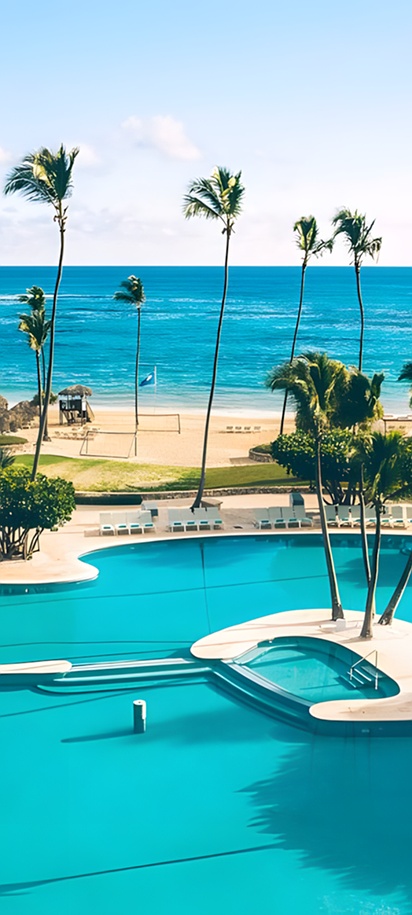 a large outdoor pool and a private beach area of the Iberostar Selection Bávaro Suites
