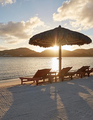 a scenic view of the Mandarin Oriental, Canouan resort located on the island of Canouan in St. Vincent and the Grenadines
