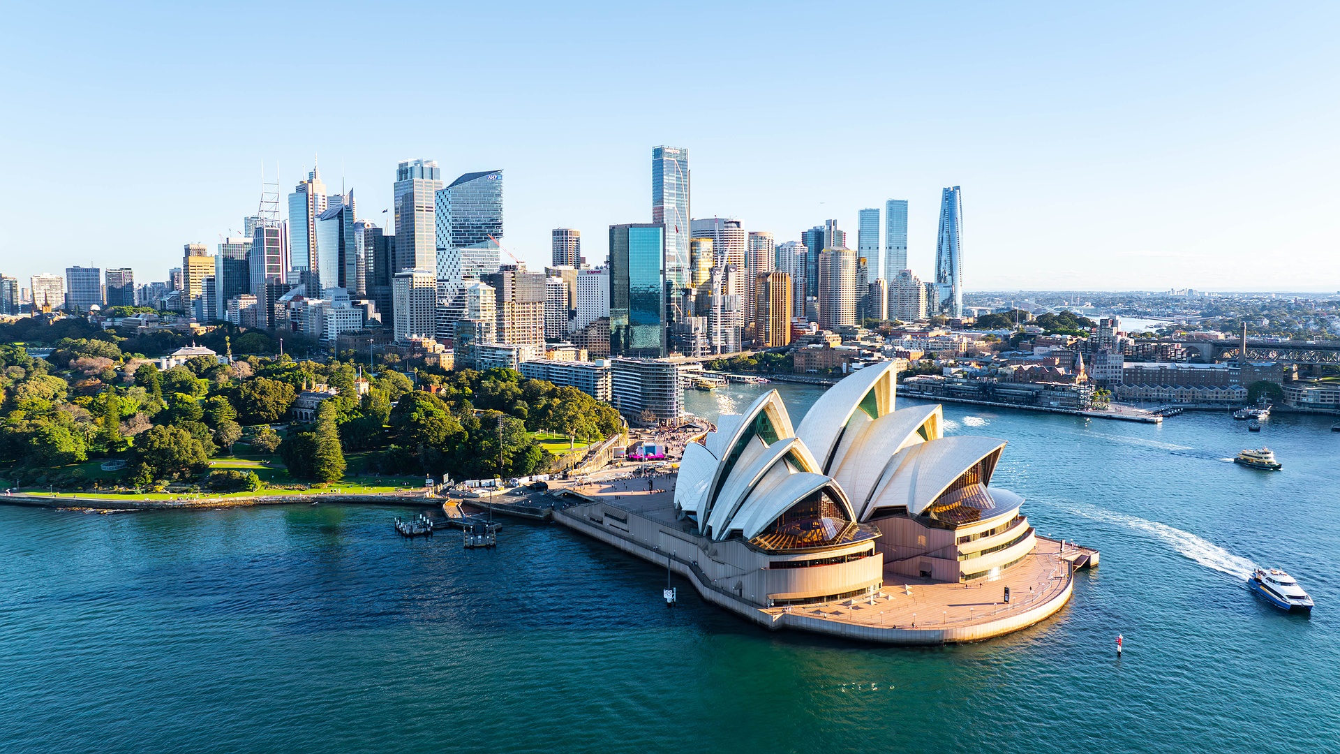 the iconic Sydney Opera House along with the surrounding cityscape of Sydney, Australia