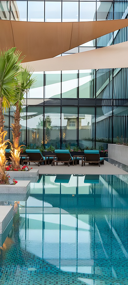 the swimming pool area at the Park Inn by Radisson Riyadh hotel in Saudi Arabia.