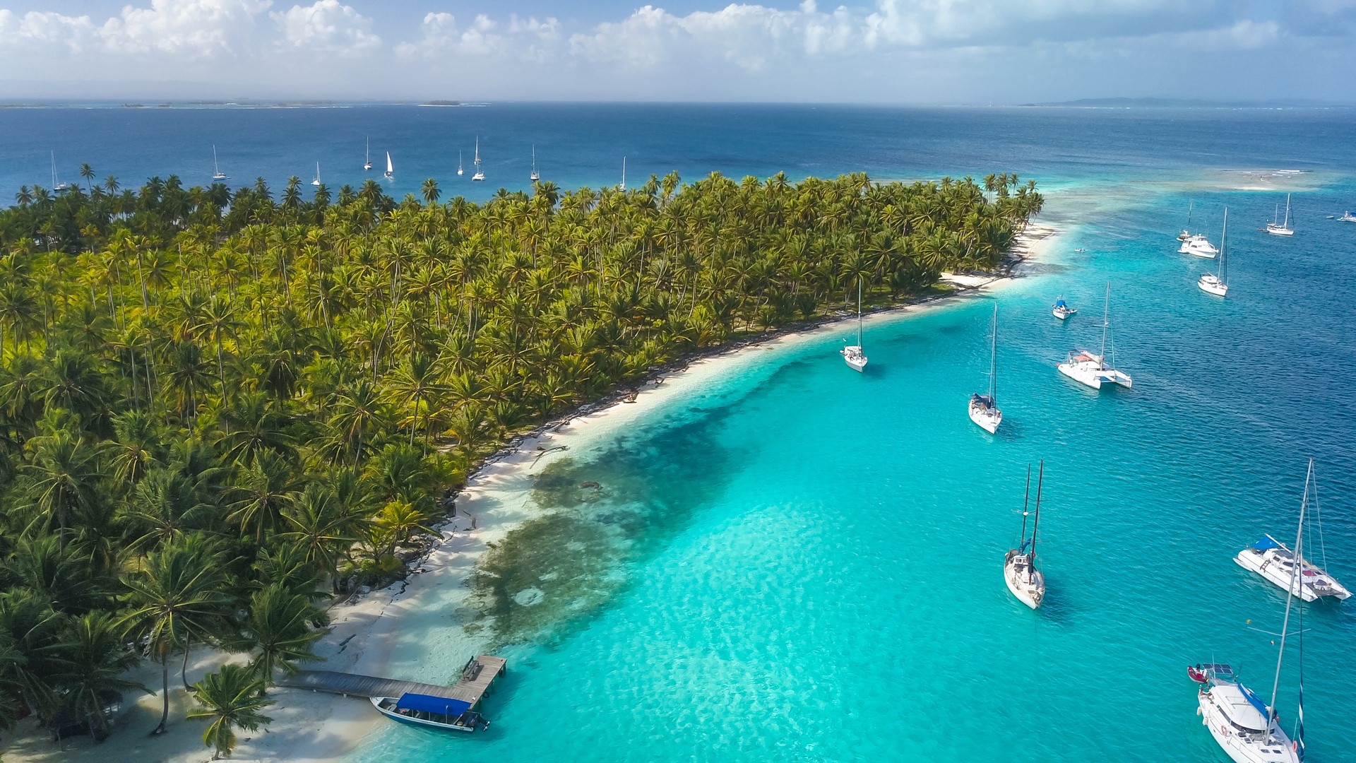 a drone aerial view of sailboats anchored of the San Blas Islands in Panama