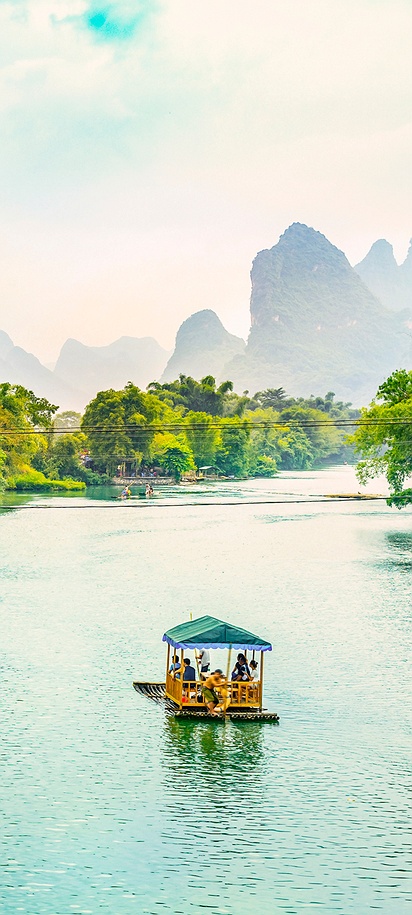 boat cruising on the scenic Li River in Guilin, China