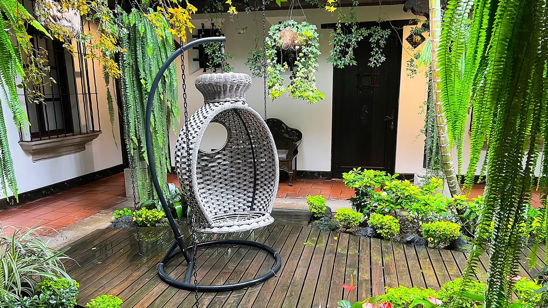 a hanging egg chair found in the courtyard of Ciel-Luxe Hotels in Antigua, Guatemala