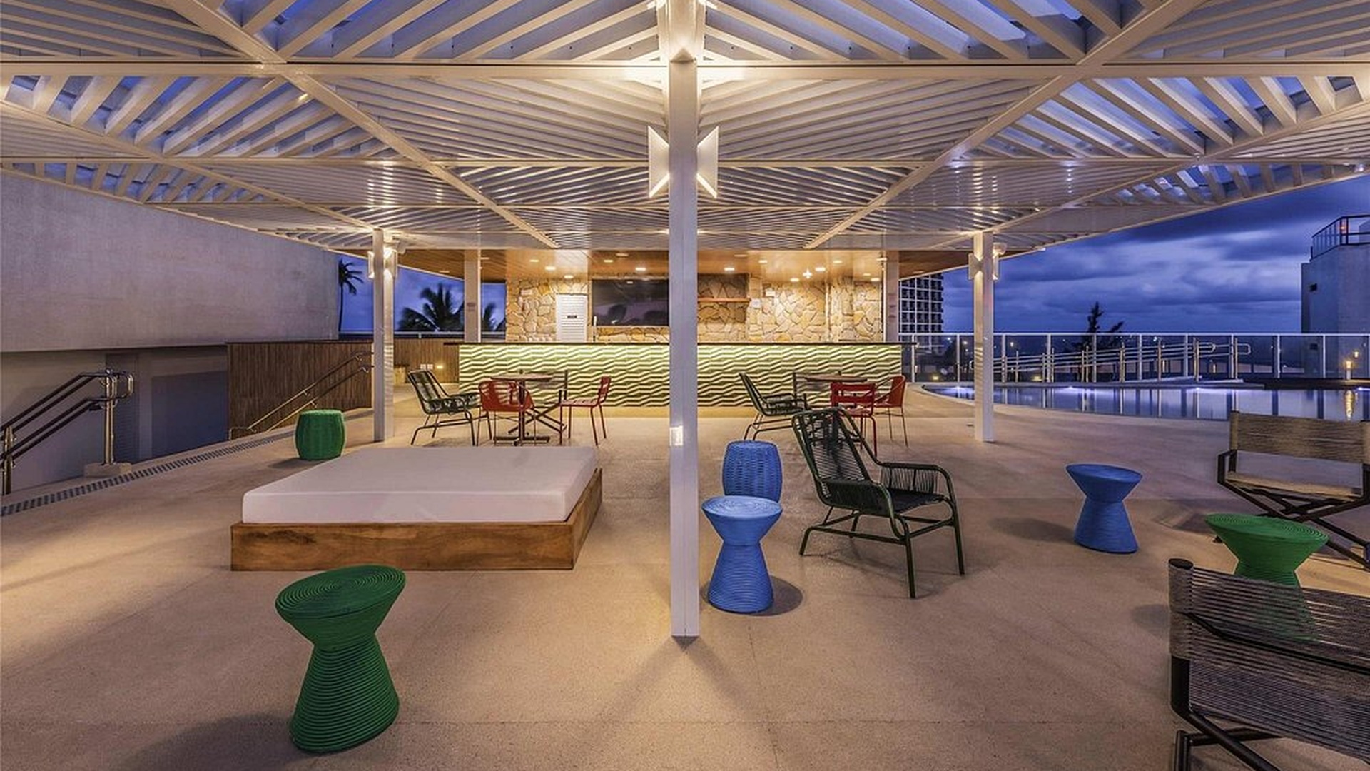 the rooftop bar and lounge area of the Novotel Salvador Rio Vermelho hotel in Brazil
