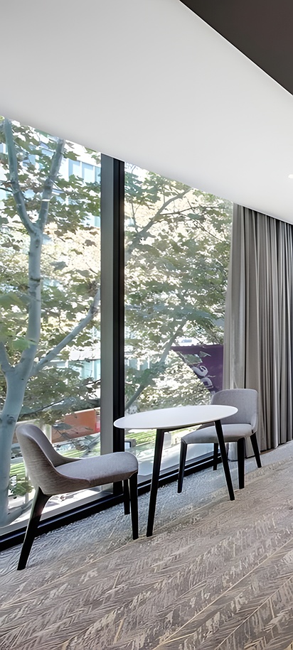 a modern, furnished room at the Vibe Hotel North Sydney