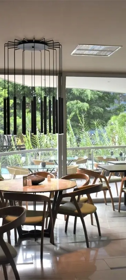 the interior of the Fiola Trattoria restaurant located inside the Hotel Estelar Blue in Medellín, Colombia