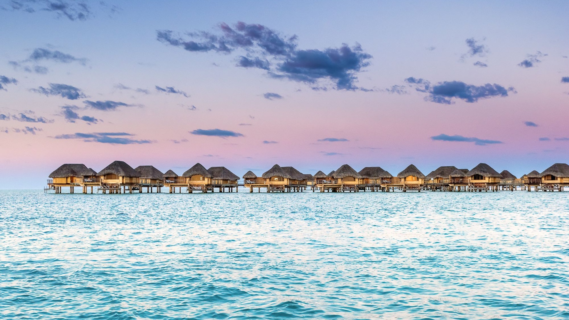 Overwater bungalows at Le Taha'a by Pearl Resorts