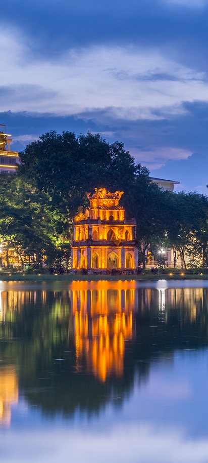 the illuminated Turtle Tower (Tháp Rùa) on Hoan Kiem Lake in Hanoi, Vietnam