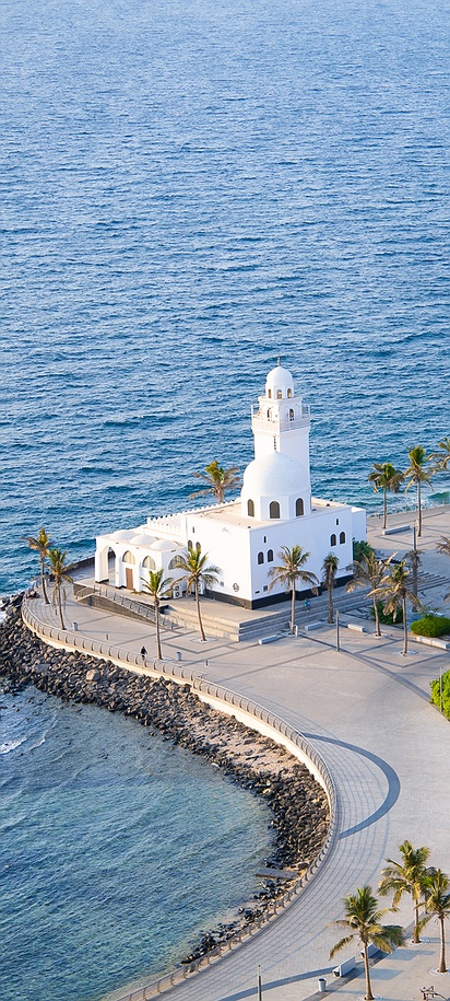 an aerial view of the Al-Rahmah Mosque, also known as the Corniche Mosque or the Floating Mosque
