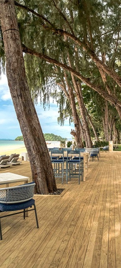 the outdoor seating area of the Breeze Beach Bar at the Dusit Thani Krabi Beach Resort