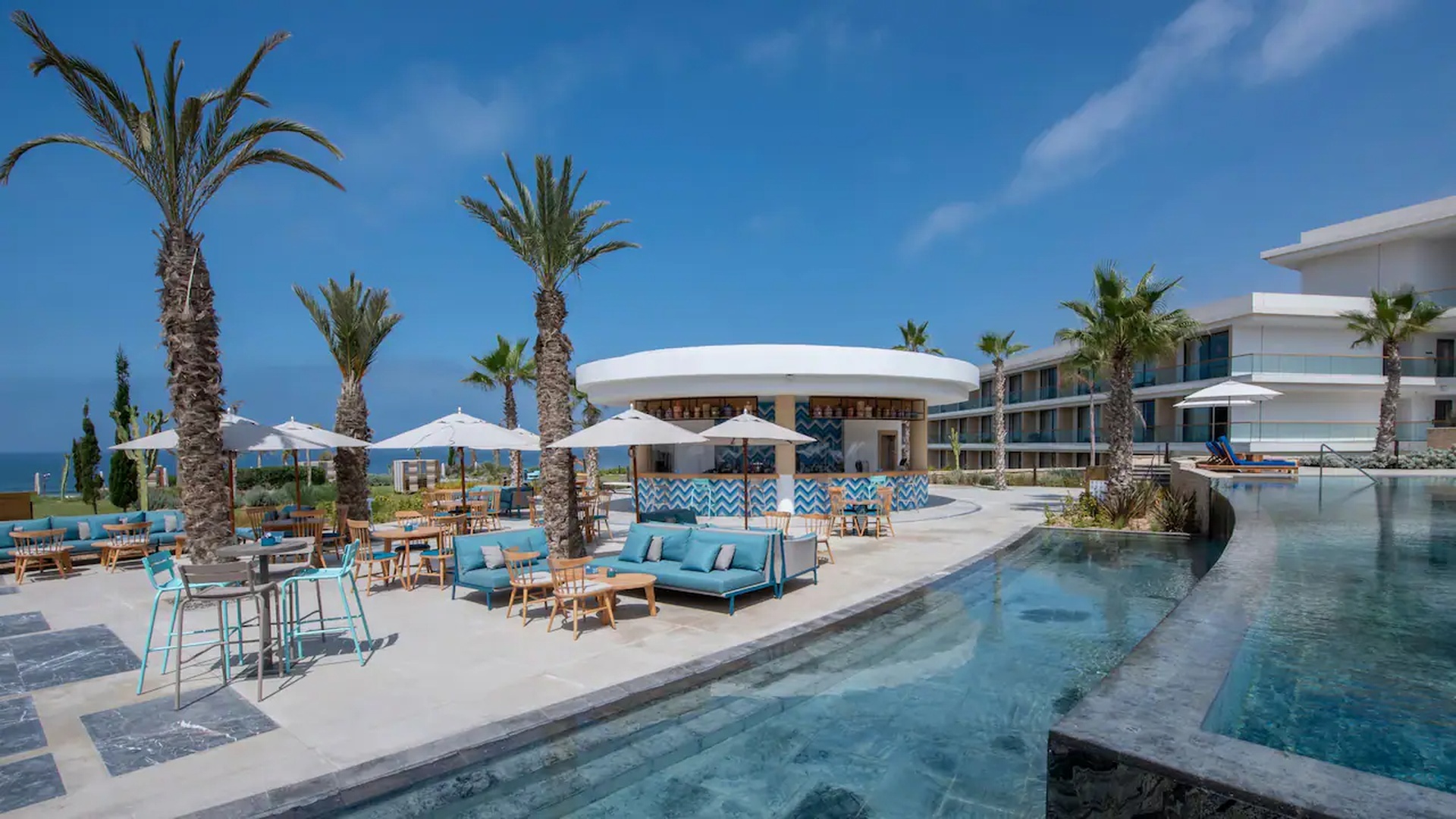 the swimming pool area and outdoor bar at the Hyatt Regency Taghazout in Morocco