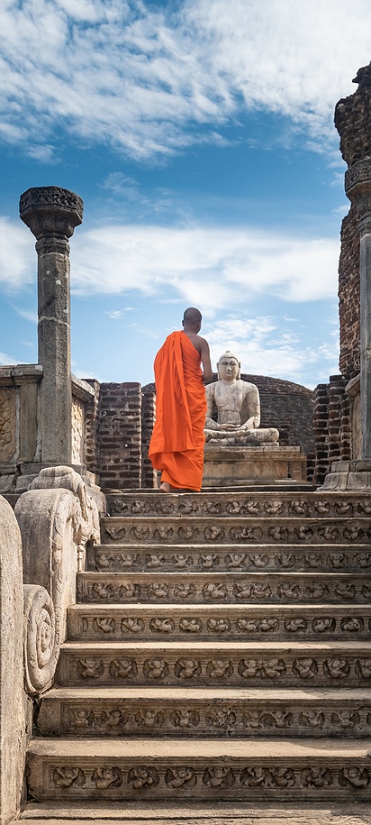 Monk at ancient ruins of Polonnaruwa