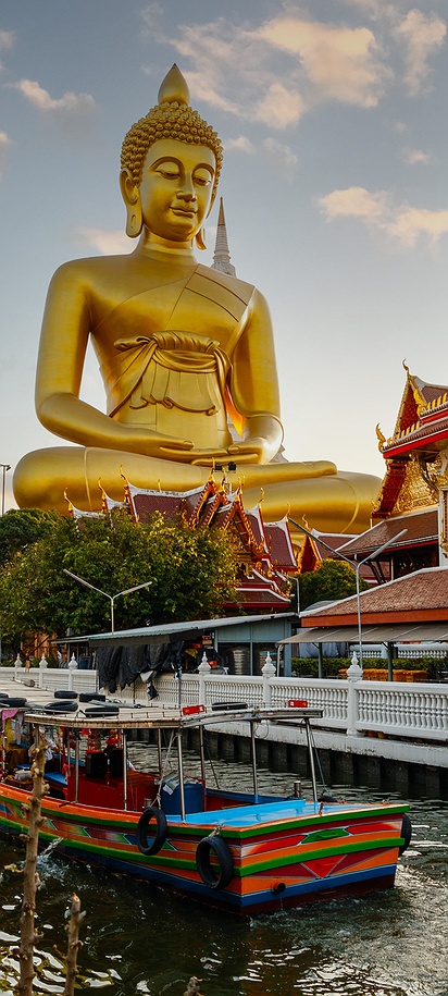 the massive seated Buddha statue at Wat Paknam Phasi Charoen in Bangkok