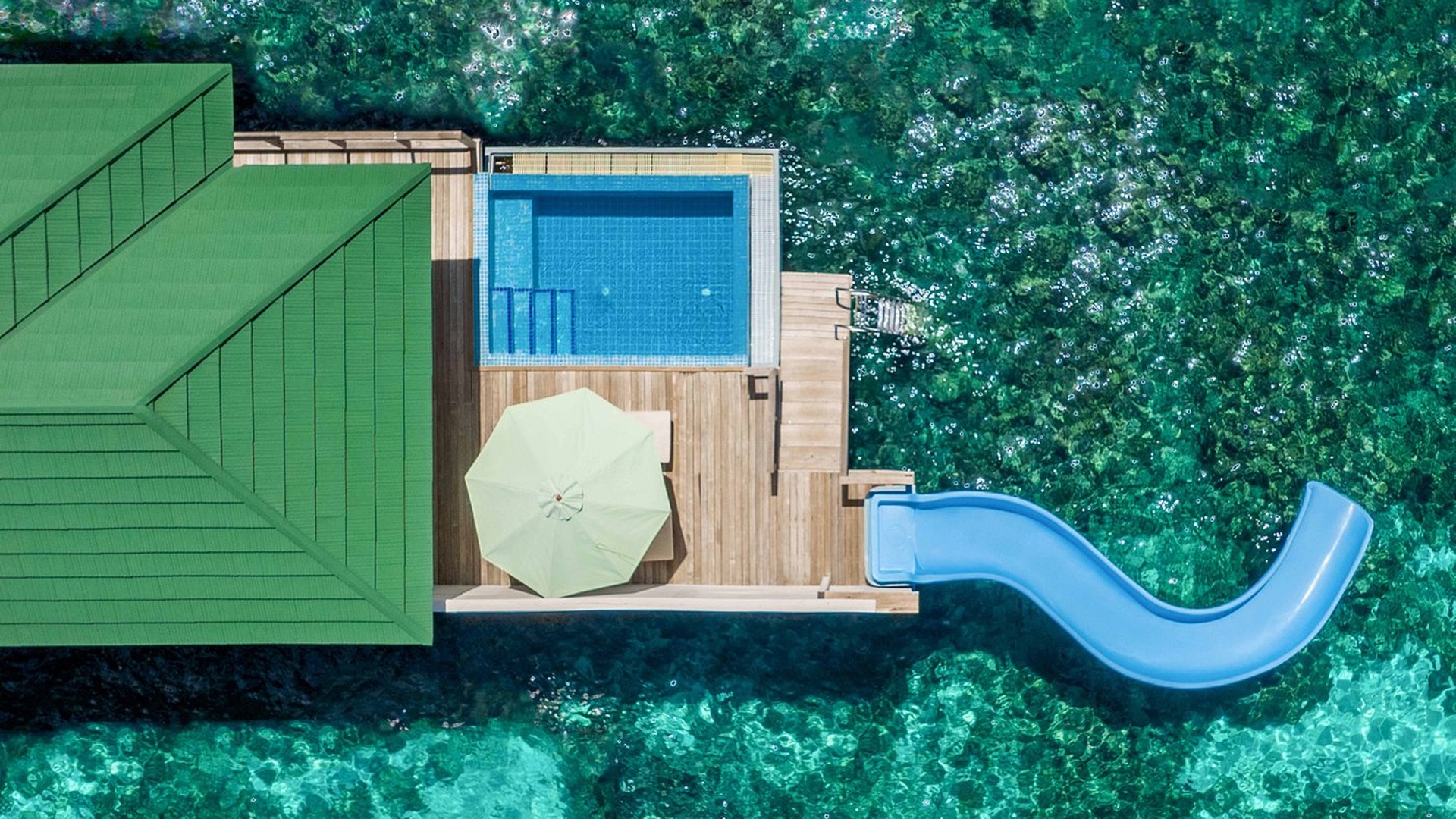 Siyam World Maldives water villa with pool and slide