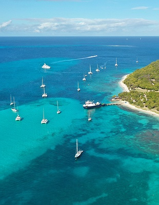 a scenic view of the Mandarin Oriental, Canouan resort located on the island of Canouan in St. Vincent and the Grenadines