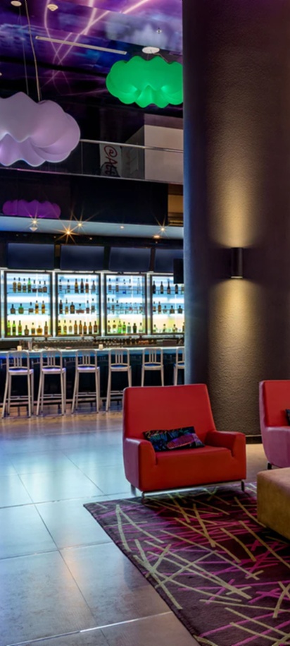 the lobby and bar area of the Aloft Panama hotel in Panama City