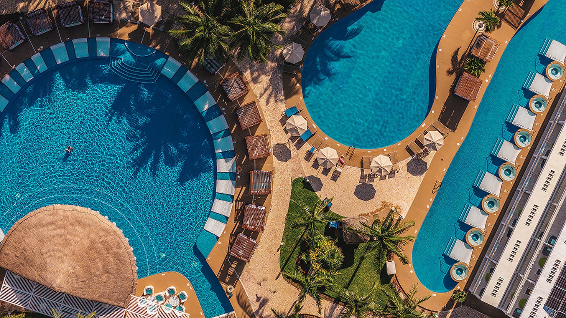 an aerial view of the swimming pools at the Jaz Makadi Saraya Resort in Makadi Bay, Egypt