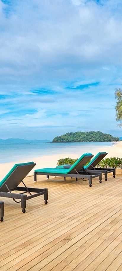 a tranquil lounging deck at the Dusit Thani Krabi Beach Resort, located on Klong Muang Beach in Krabi, Thailand