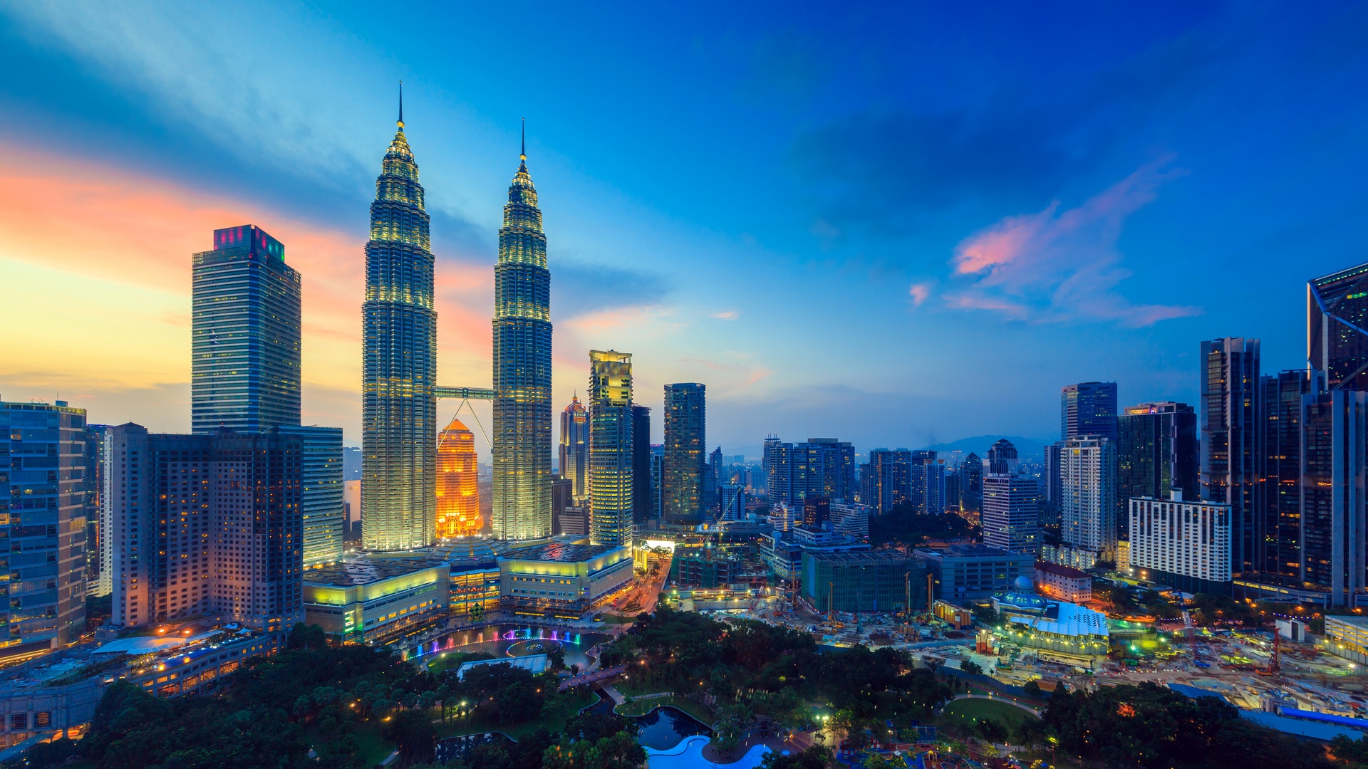 the Petronas Twin Towers in Kuala Lumpur, Malaysia, at sunset