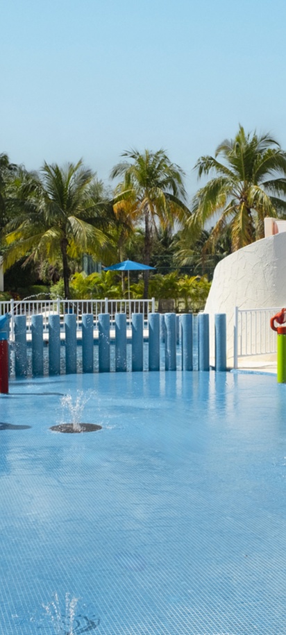a swimming pool area at the Iberostar Selection Riviera Cancún resort, located near Puerto Morelos, Mexico