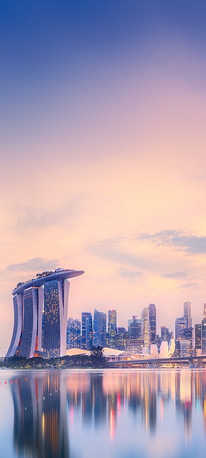 scenic view of the Singapore skyline featuring the Marina Bay Sands resort and the Singapore Flyer Ferris wheel