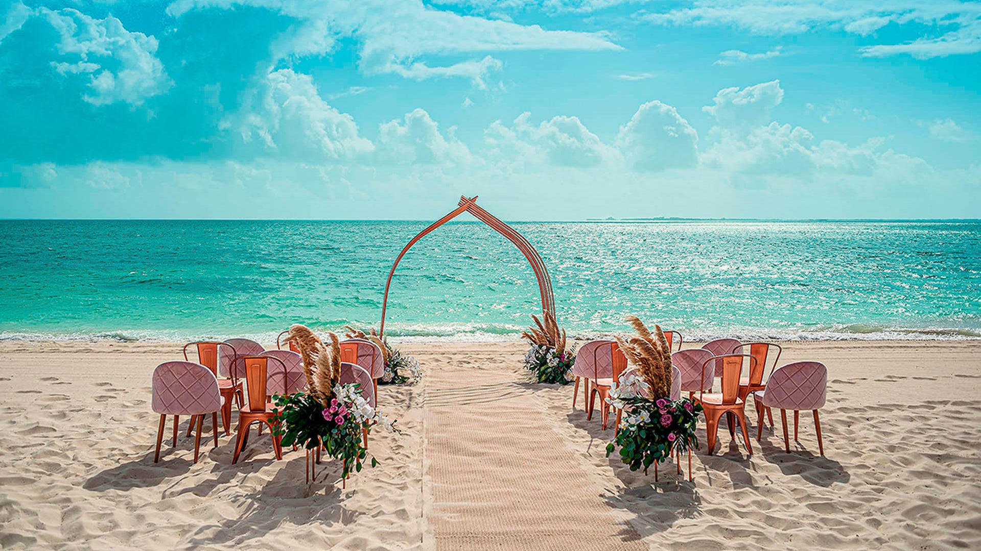 Beach wedding setup at Atelier Playa Mujeres