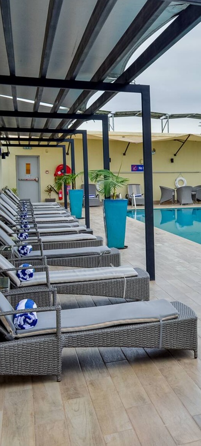 the rooftop outdoor swimming pool and sun loungers at the Hilton Garden Inn Nairobi Airport