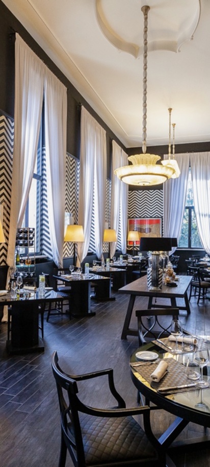 the interior of a restaurant located within the TH Roma - Carpegna Palace hotel in Rome